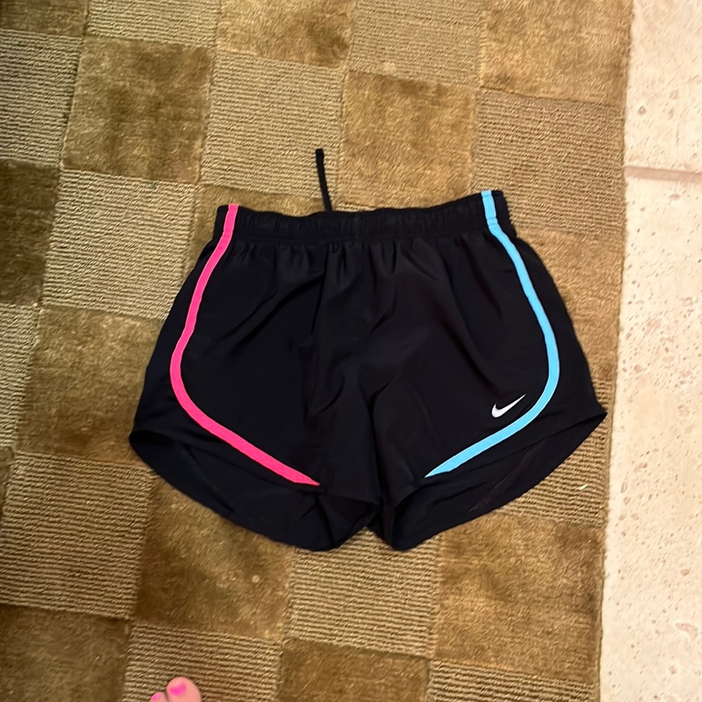 Black Nike Dry fit running shorts with neon accents on front and back.